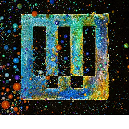 The WIRED logo rendered in a colorful, textured, particle-like style against a black background