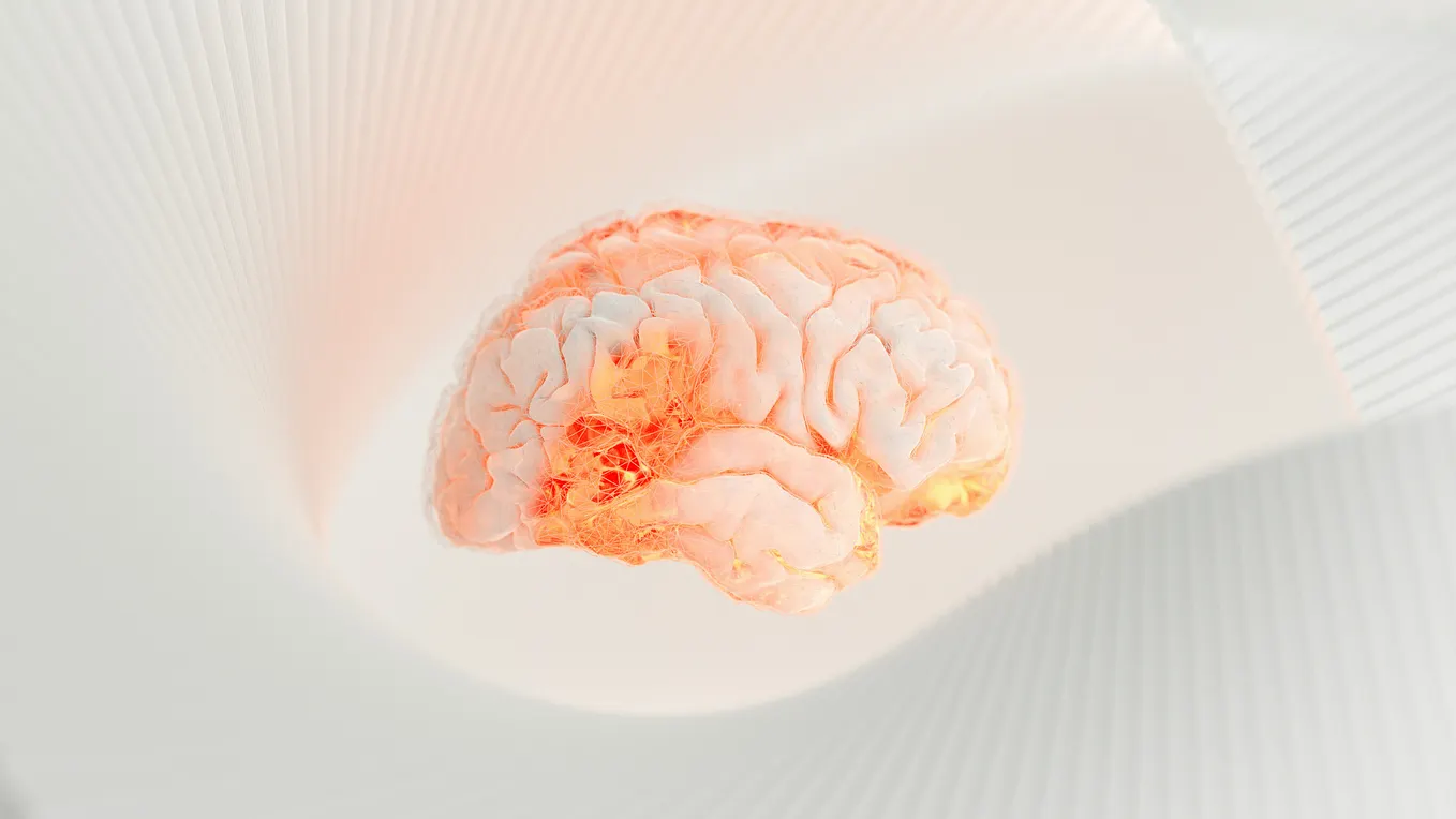 A glowing human brain floating in a white, abstract space.