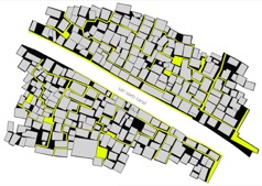 A map-like diagram showing a network of streets and blocks, with some areas highlighted in yellow.