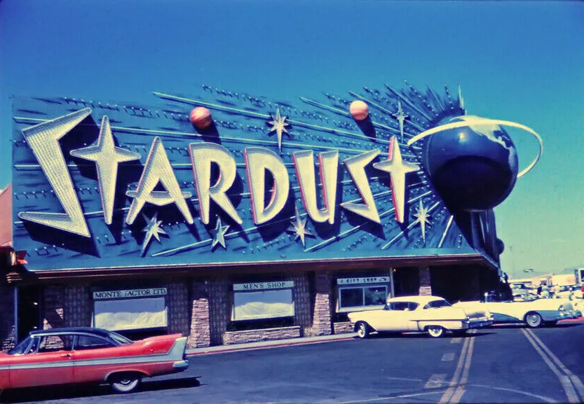 The Stardust Hotel and Casino sign and storefronts in Las Vegas