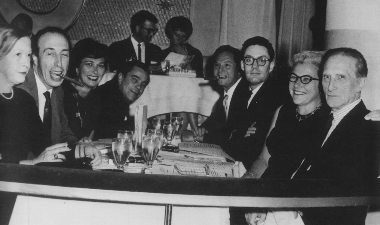 A group of people sitting at a table in the Stardust Hotel and Casino in Las Vegas in 1963.