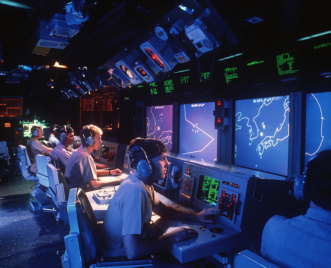 The combat information center aboard a warship—proposed as a real-life analog to a Chinese room, 1988. License: Public Domain.